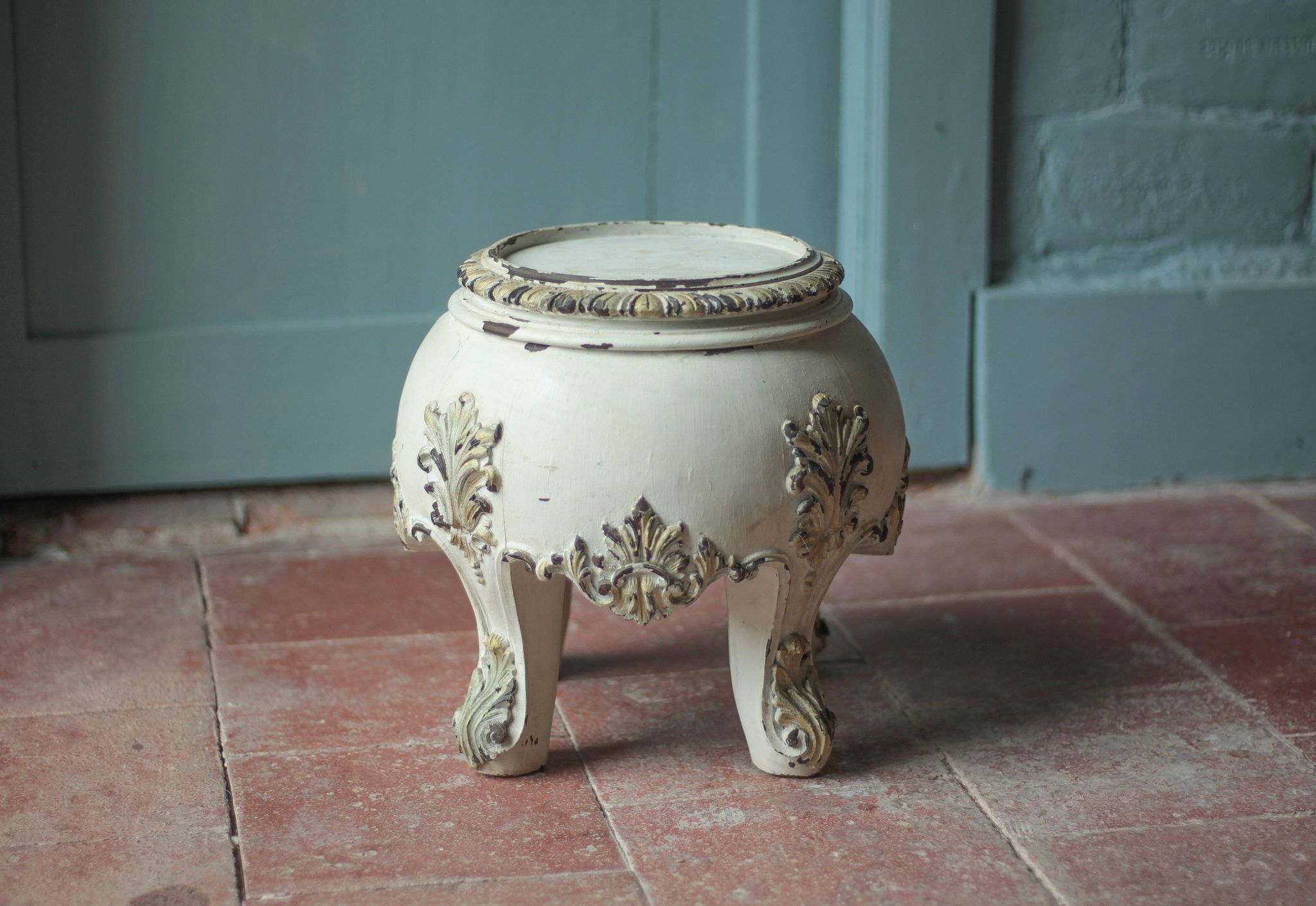 Solid wood plant stand with Louis XV style palm leaf motifs.