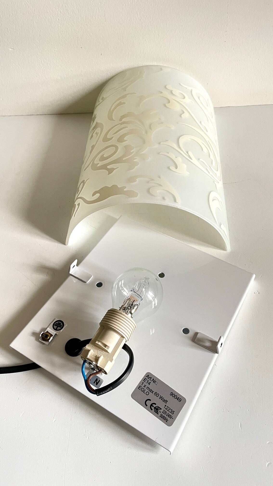 Polished and screen-printed glass sconce by eglo