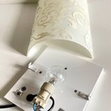 Polished and screen-printed glass sconce by eglo