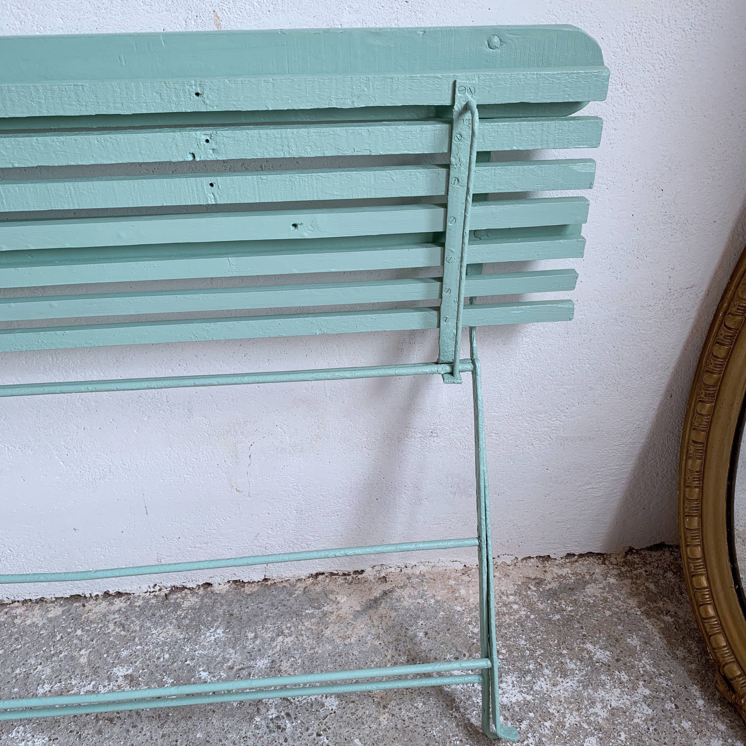 Former folding garden bench with wooden and metal slats
