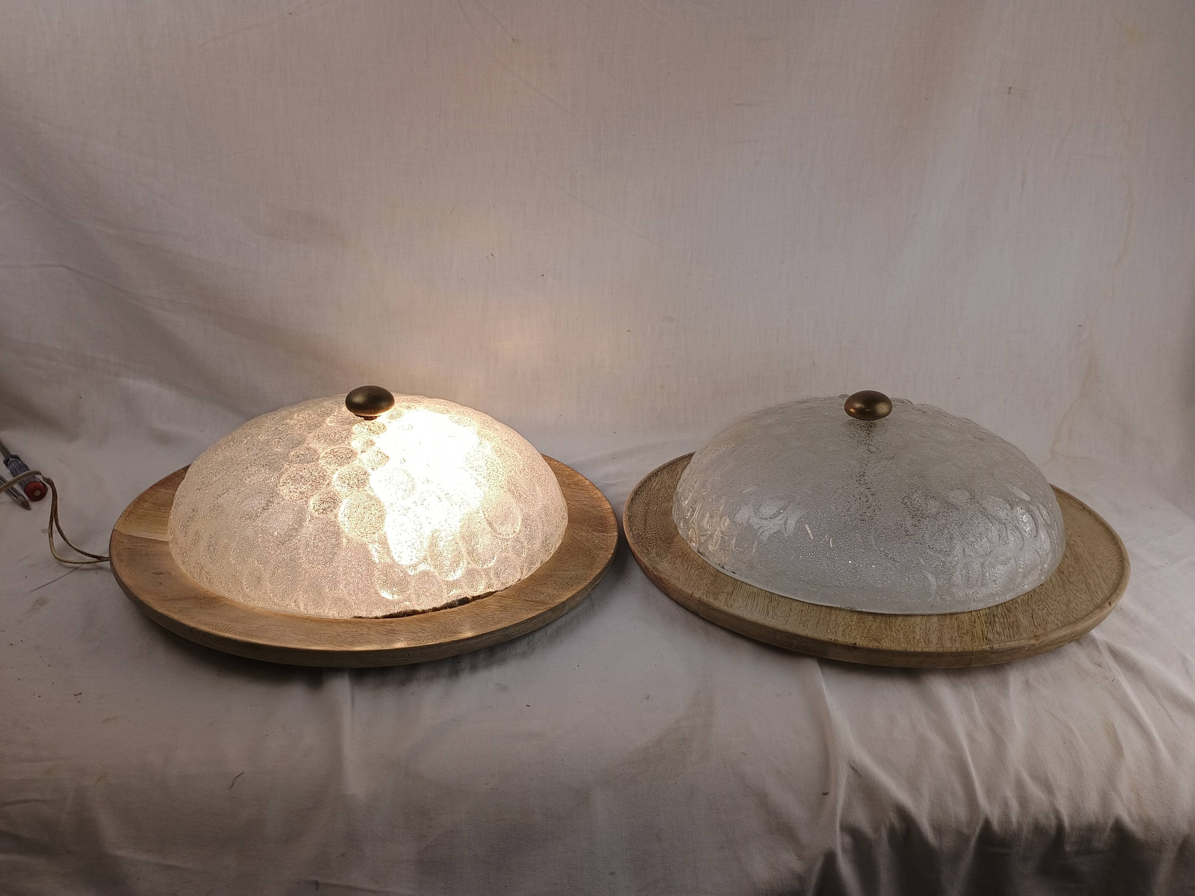 Pair of vintage Murano wall lights with exotic wood shelf.