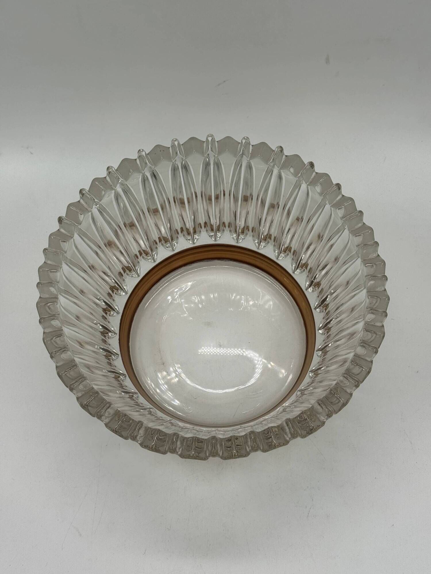 Crown coupe in ribbed glass with a brass base.