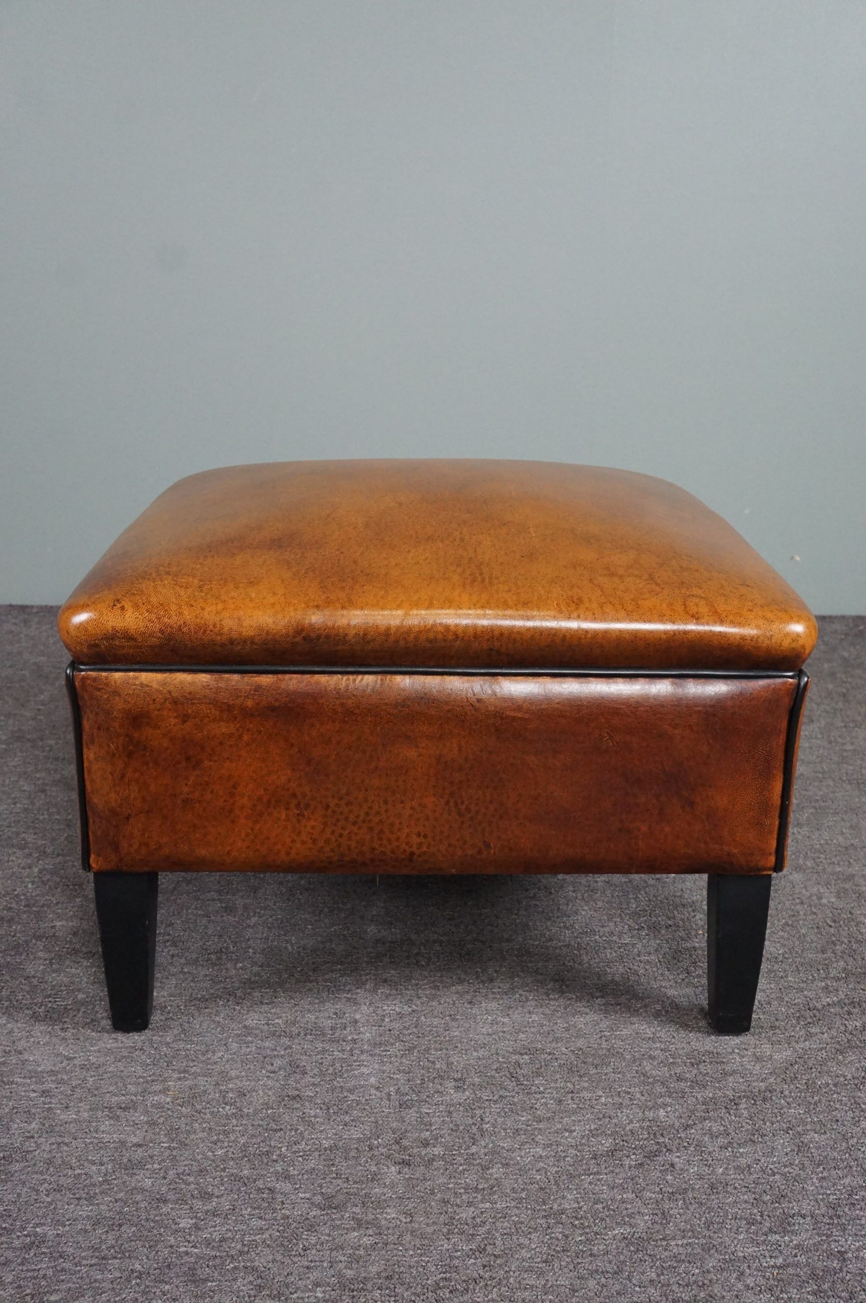 Schapenleren armchair and studio lounge stool