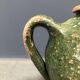 Dark green jug enamelled