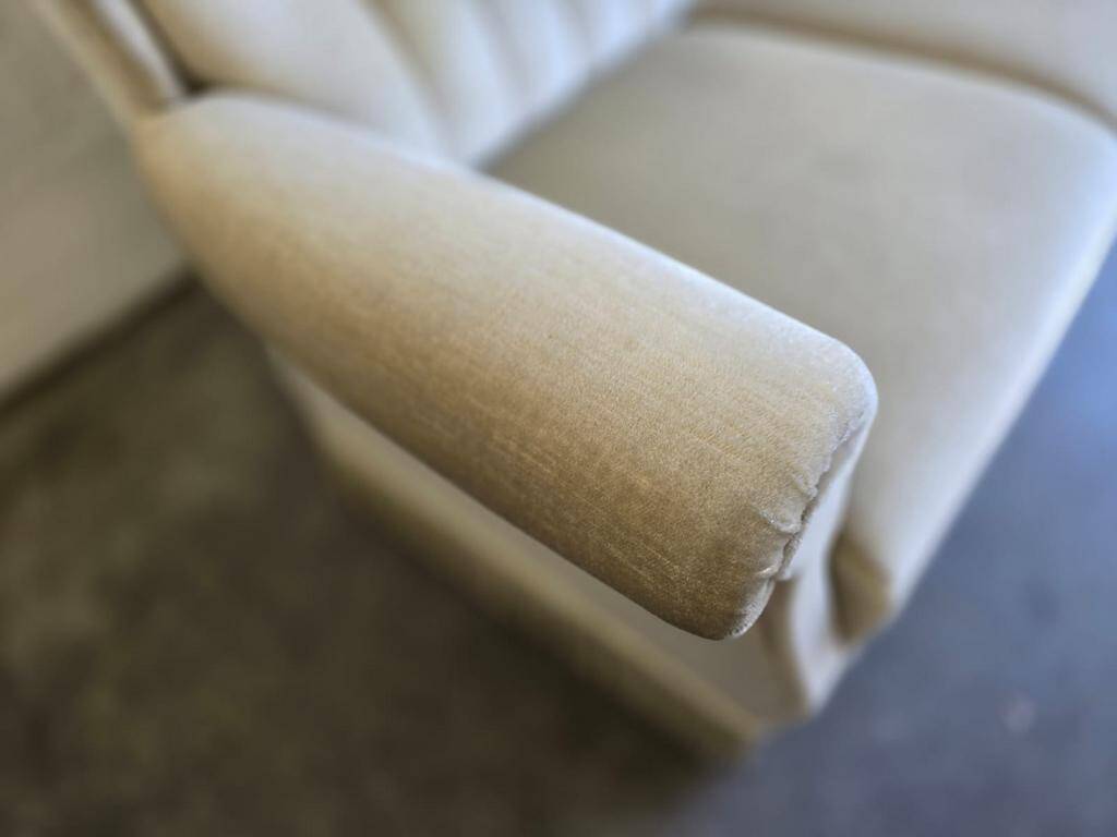 Vintage beige sofa with fringes