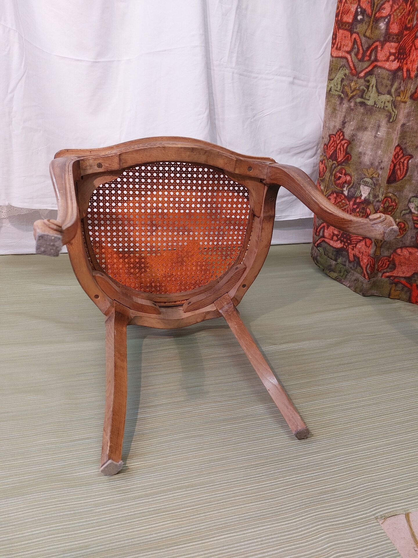 Caned chair in Louis XV style painted orange.