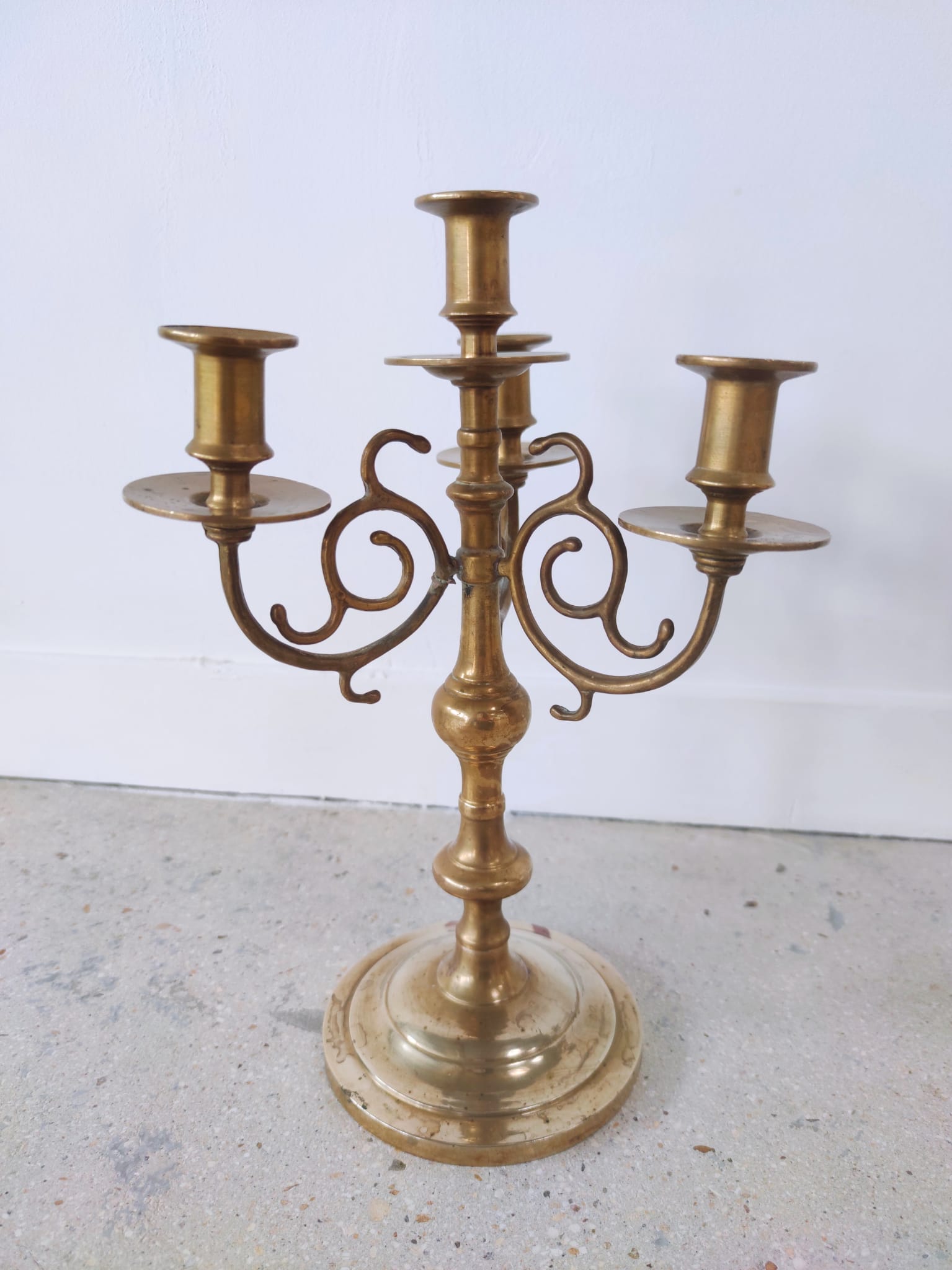 Pair of four-light candle holders in gilded brass
