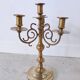 Pair of four-light candle holders in gilded brass