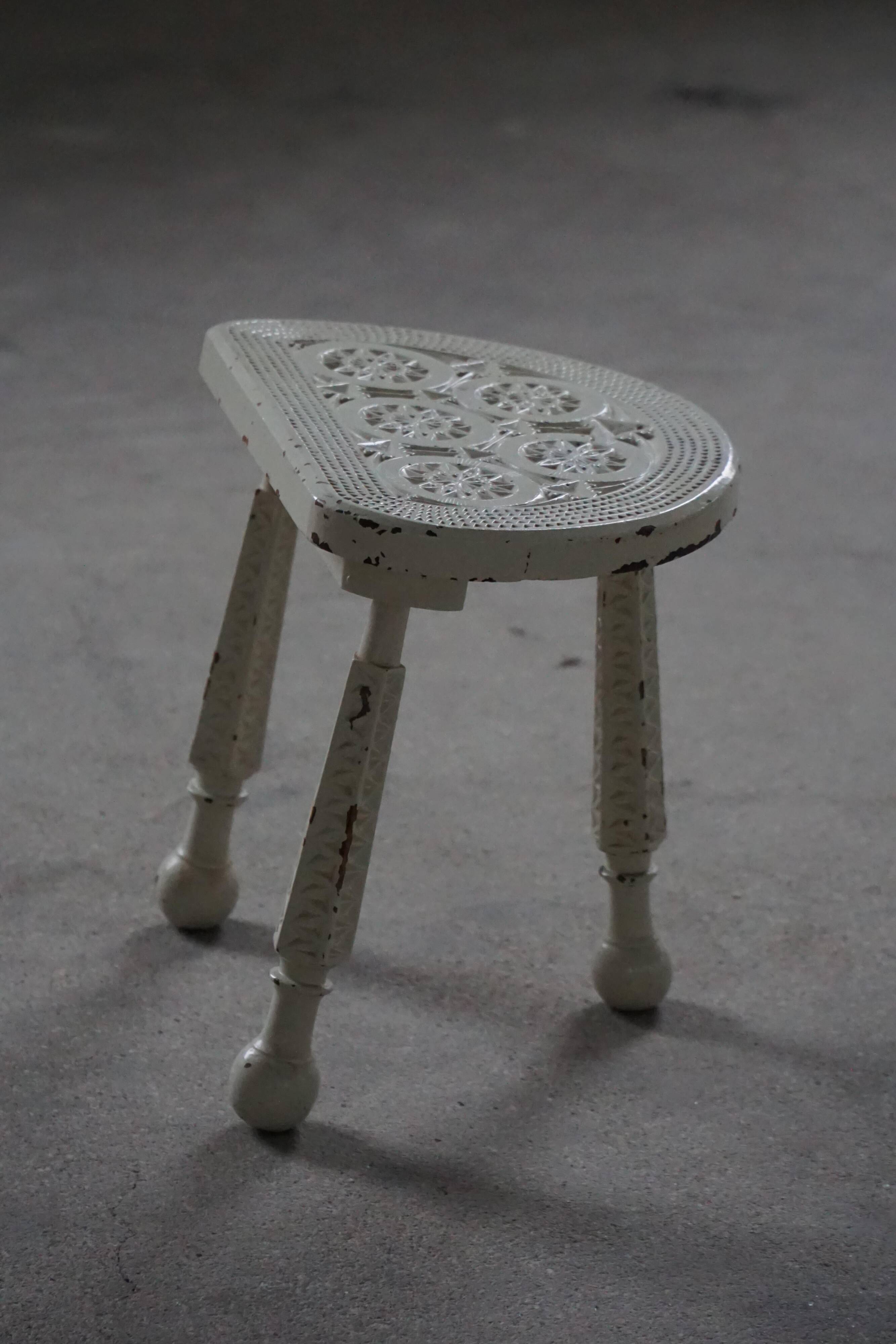 Tripod wooden stool with carved details, early 20th century Danish, 1930s.