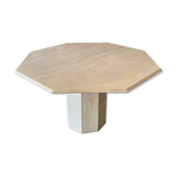 Light-colored octagonal travertine dining table