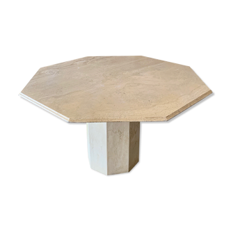 Light-colored octagonal travertine dining table