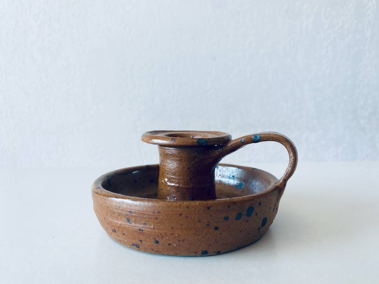 Signed sandstone candle holder