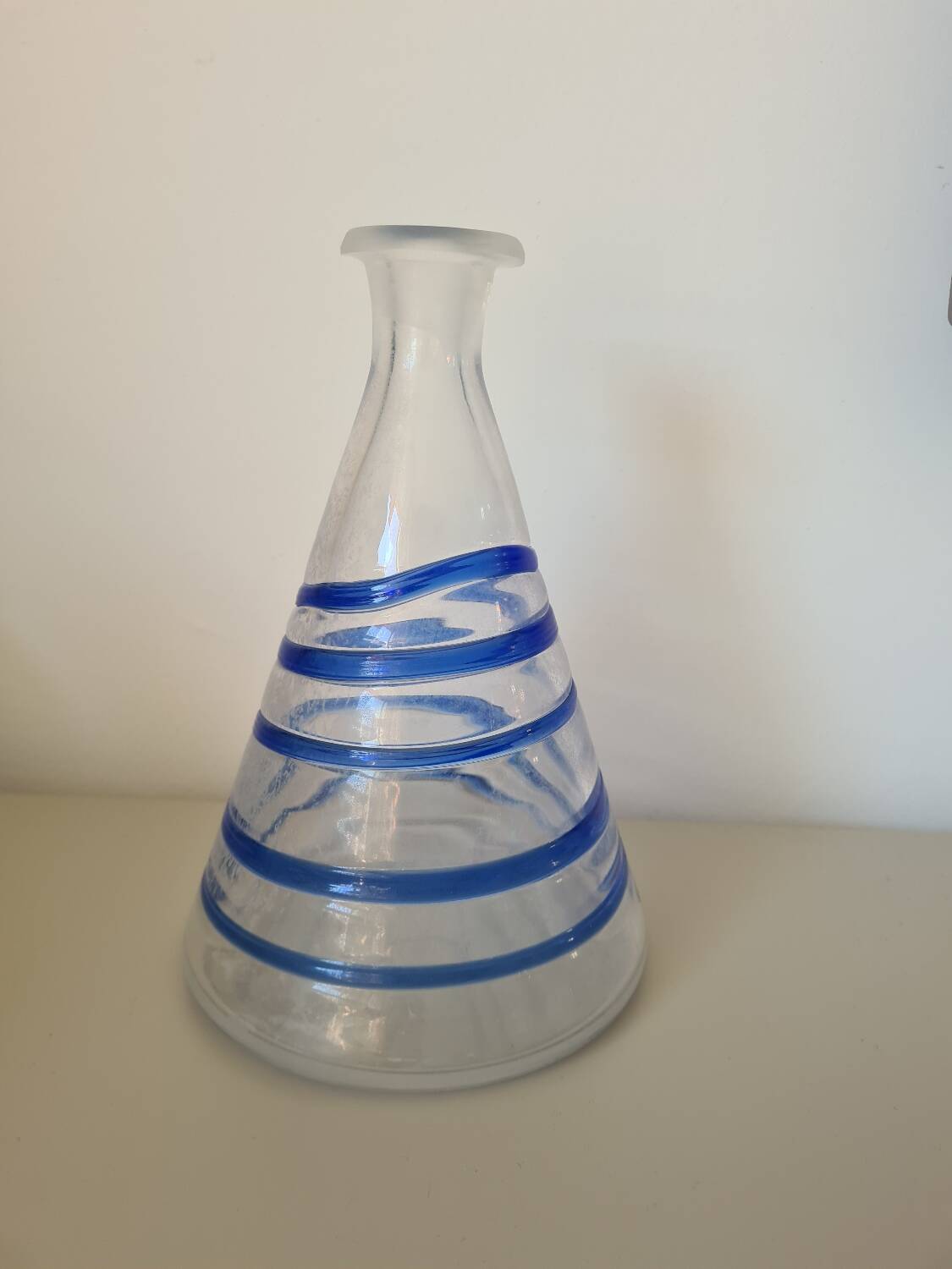 Conical glass vase/carafe blown with a blue spiral decoration.