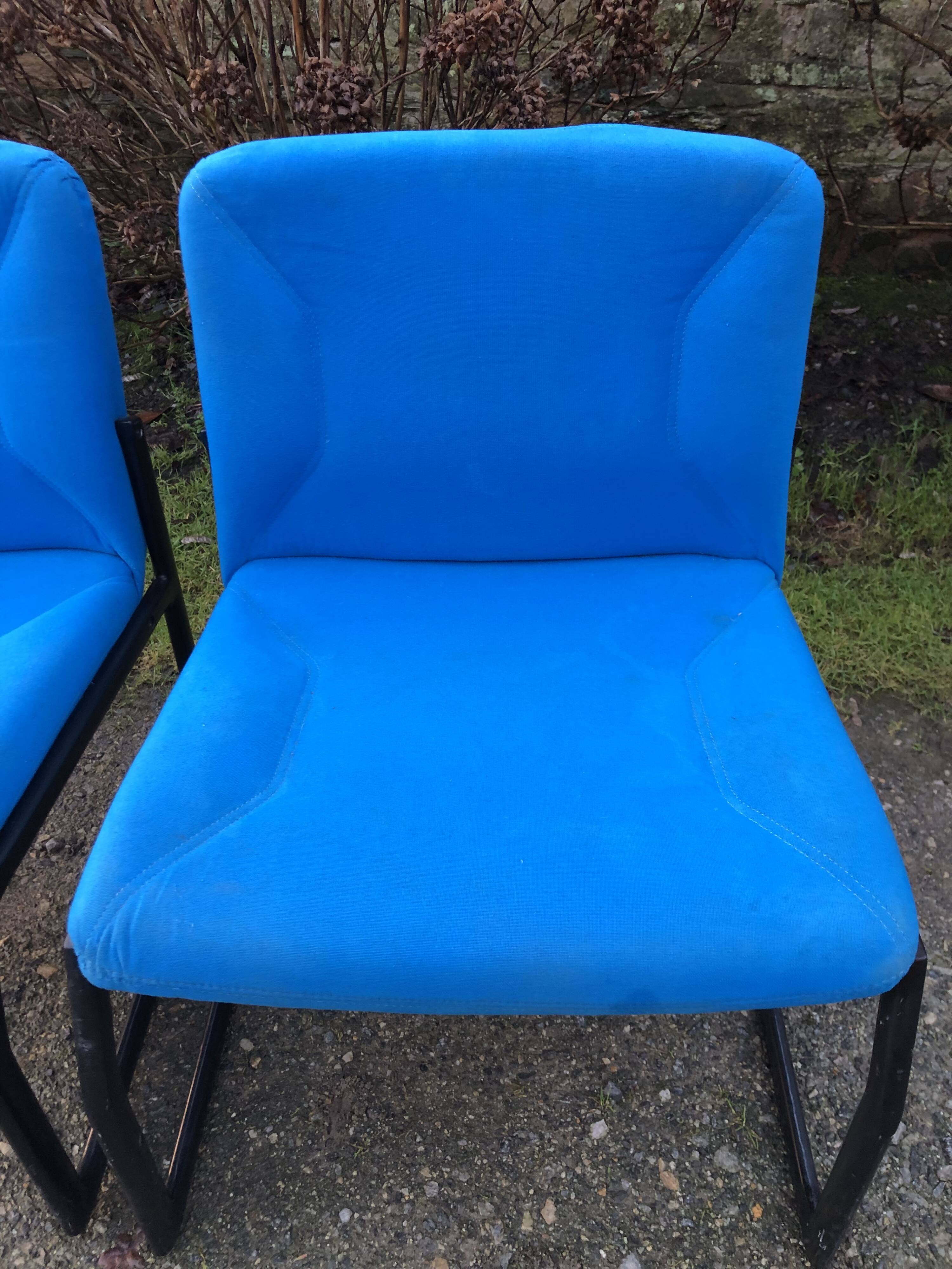 Electric blue fabric designer armchairs with black lacquered metal legs from the 80s.