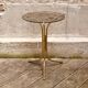 Golden pedestal table in smoked glass