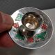 Silver-plated candle holders with inlaid red and green enamel