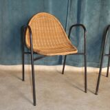 Pair of chairs / vintage armchairs in rattan and black lacquered metal