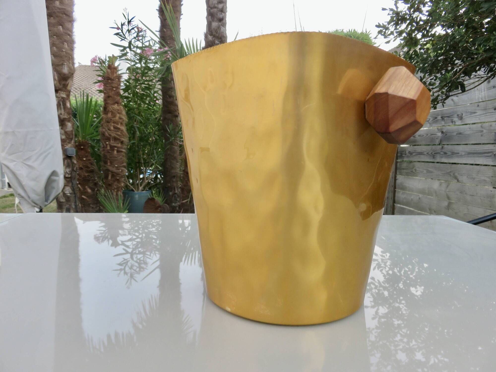 Gold anodised aluminium ice bucket, teak handles, signed T.L PARIS.