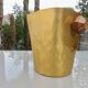 Gold anodised aluminium ice bucket, teak handles, signed T.L PARIS.