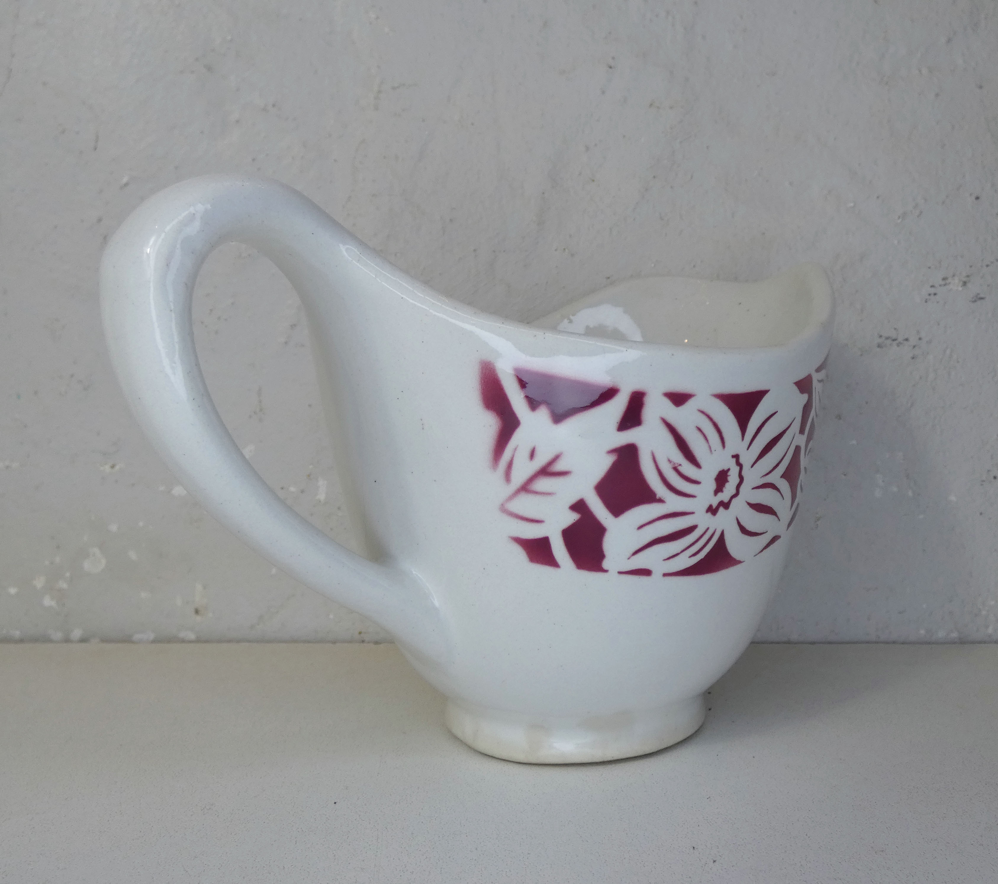 Old creamer milk pot in earthenware of Lunéville