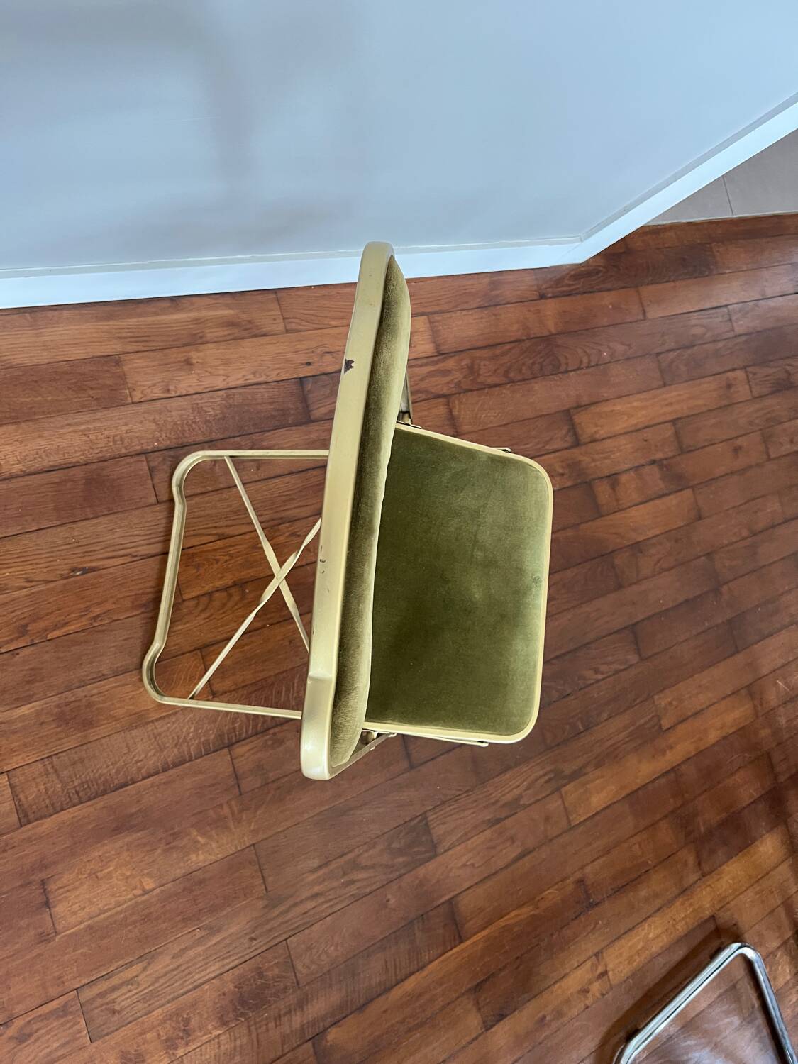 Green velvet folding chair