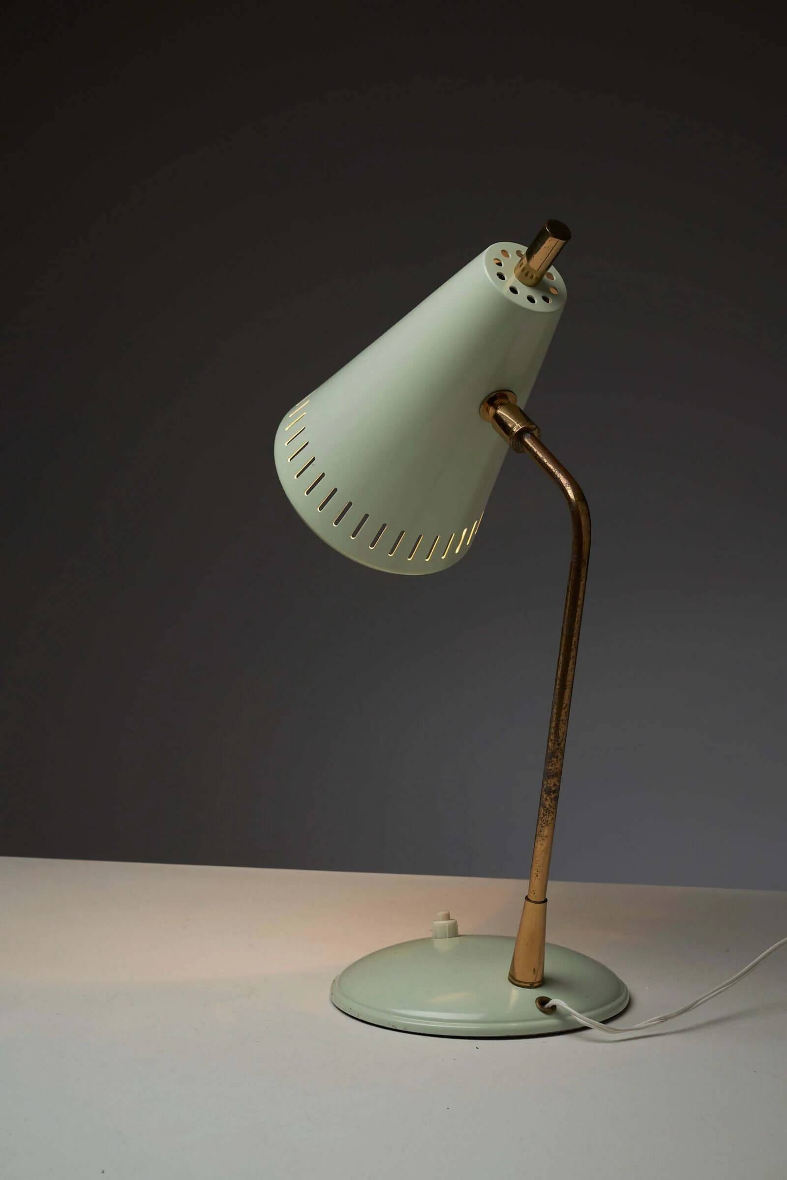 Adjustable table lamp in patinated brass and green metal