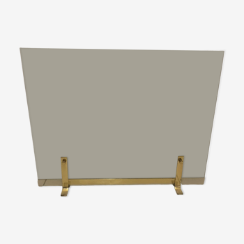 Fireplace screen in smoked glass and brass