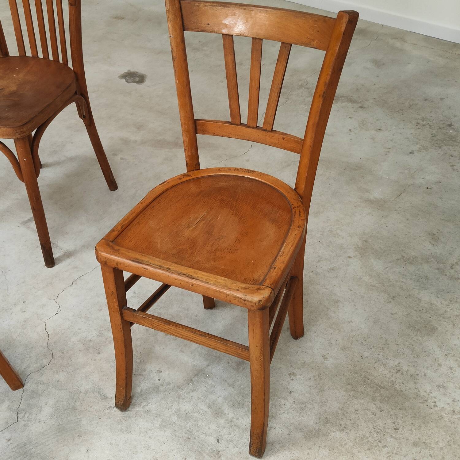 Set of 6 mismatched blond wood bistro chairs