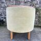 Pair of barrel-shaped armchairs in beech and almond green velvet by Maison Rosello