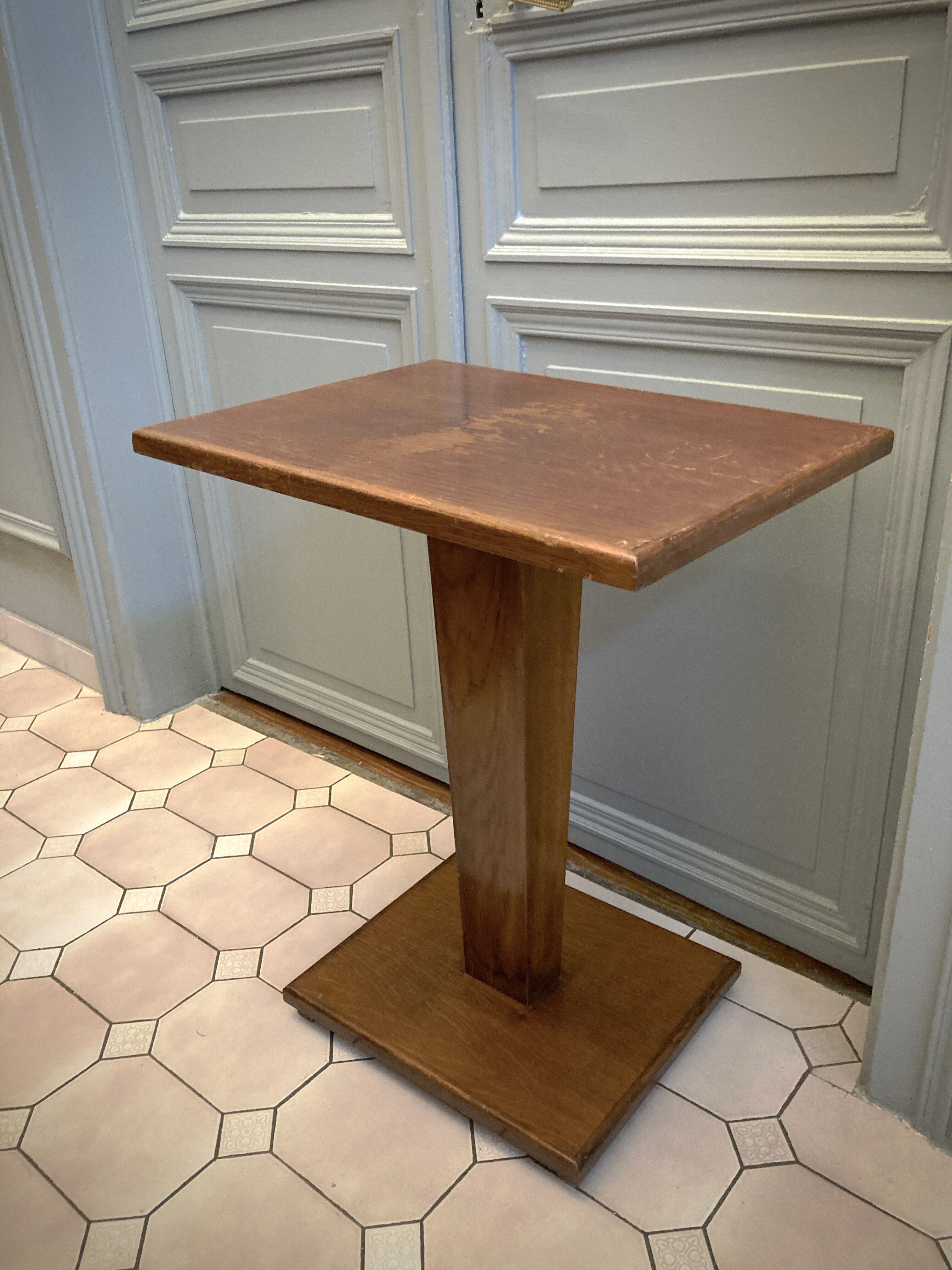 Square pedestal table with central foot 1930