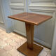 Square pedestal table with central foot 1930