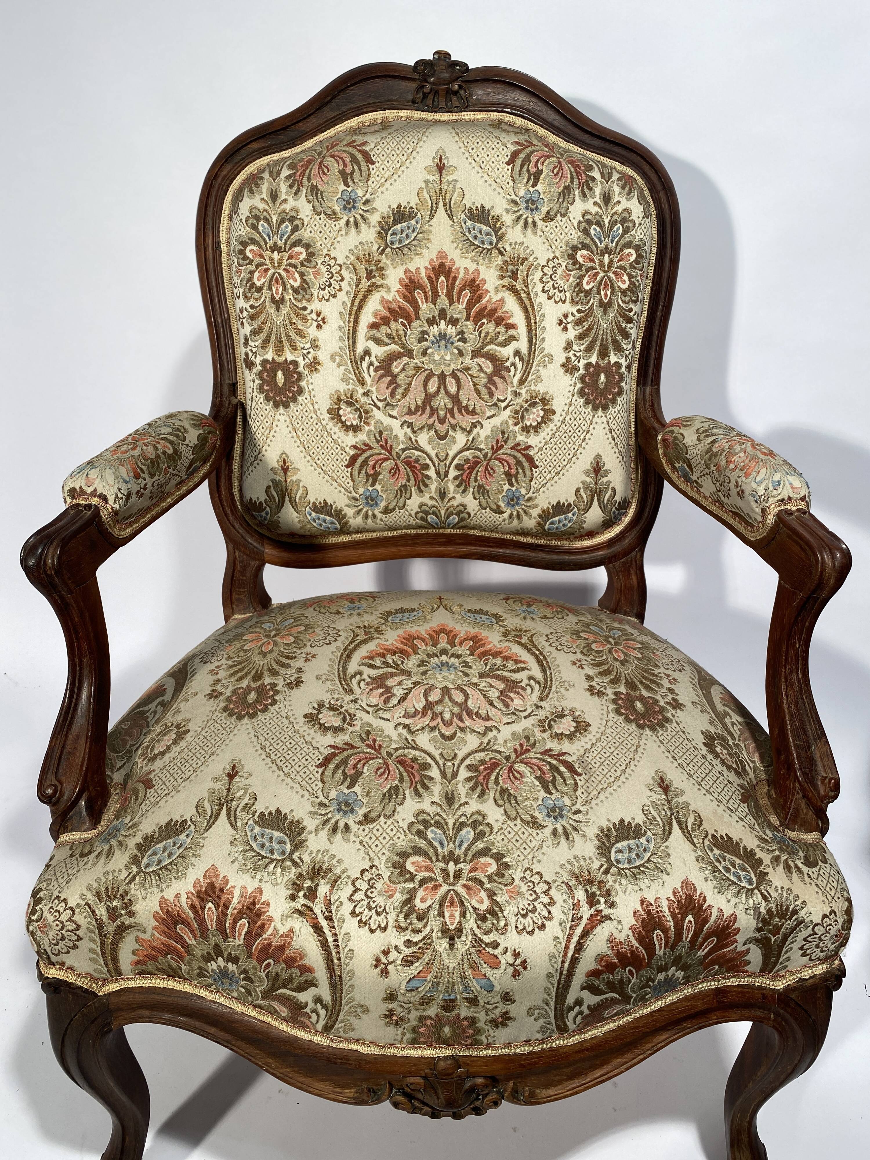 Louis XV style living room including a pair of armchairs and three chairs