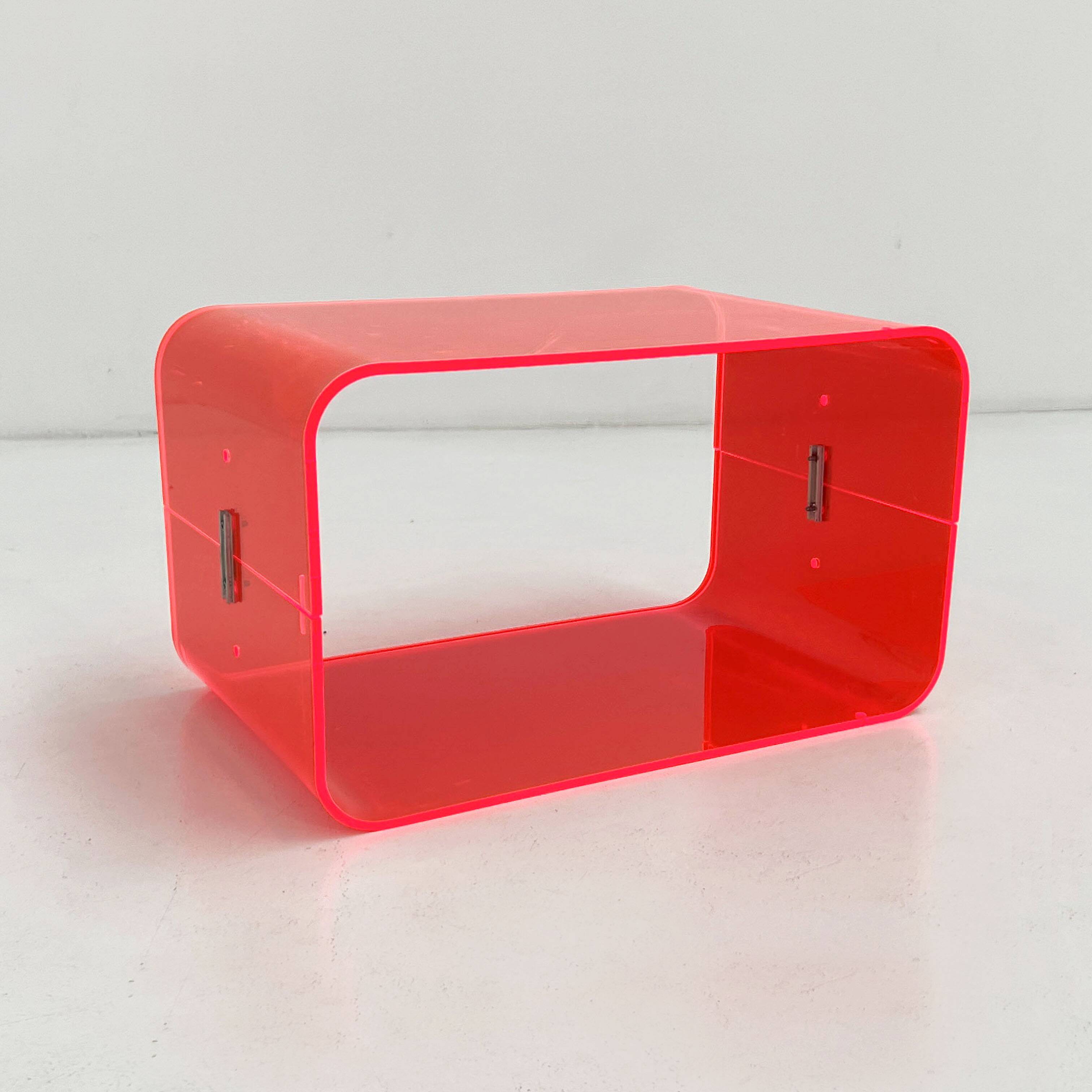 Fluorescent pink plexiglass coffee table, 1980.