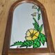 A pair of vintage stained glass style mirrors.