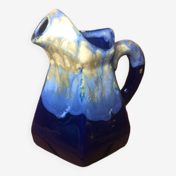 Old vintage blue ceramic pitcher