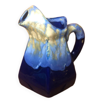 Old vintage blue ceramic pitcher