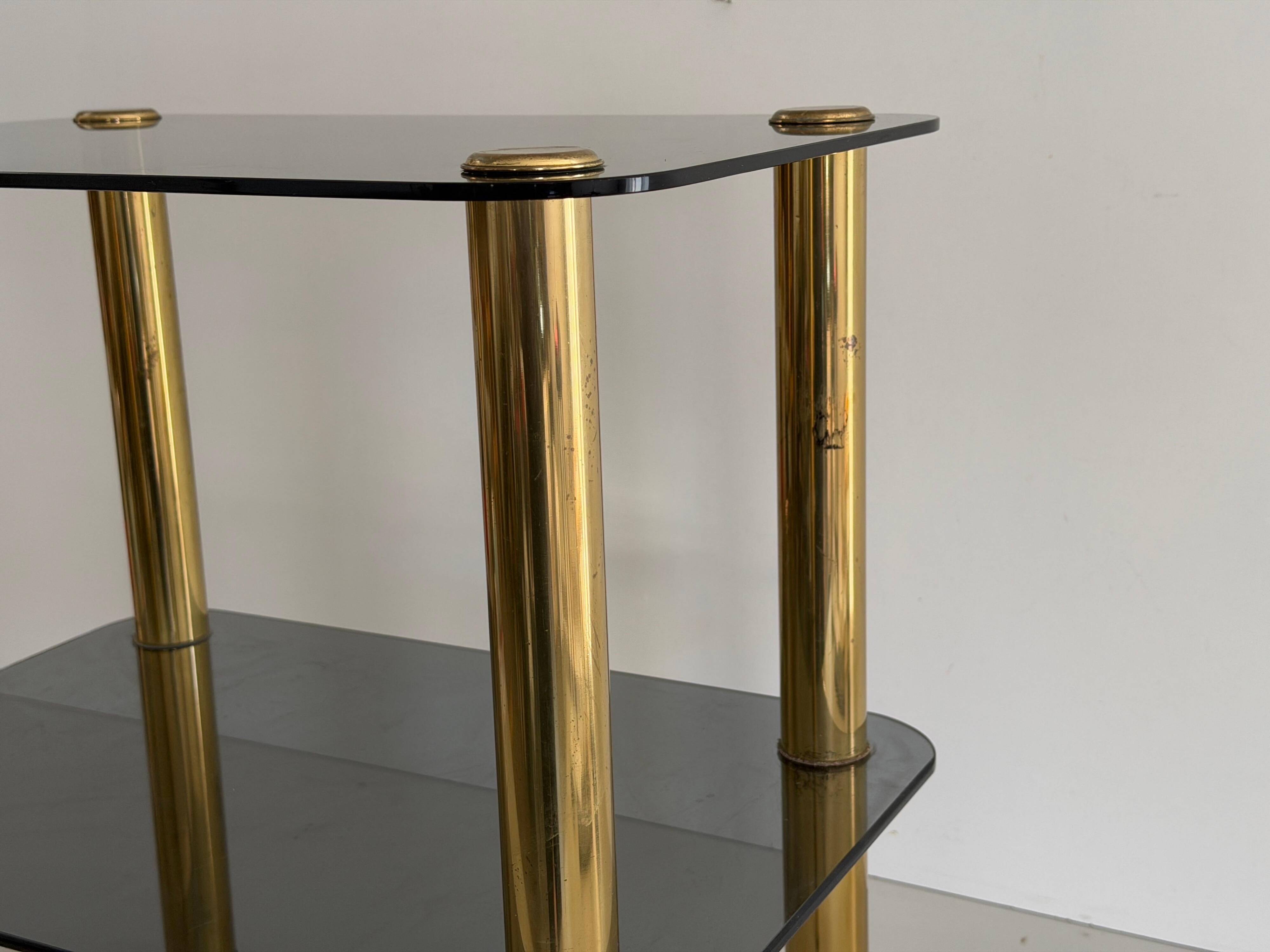 Side table in thick greenish glass with brass legs, Italy, 1960s.