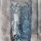 Blue glass with fruit relief decoration