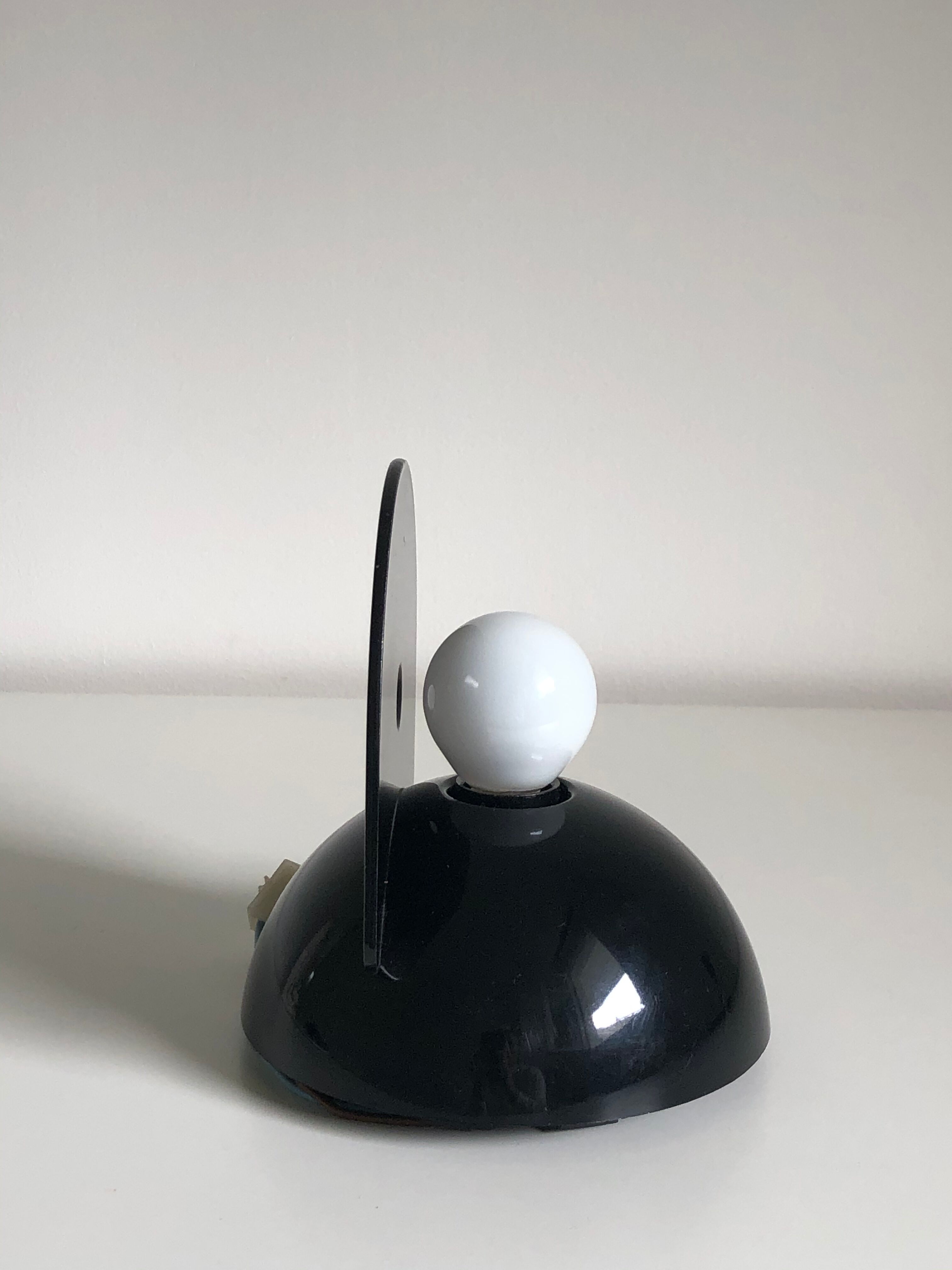 Claudio Dini's black Buco applicator edited by Artemide, 1974