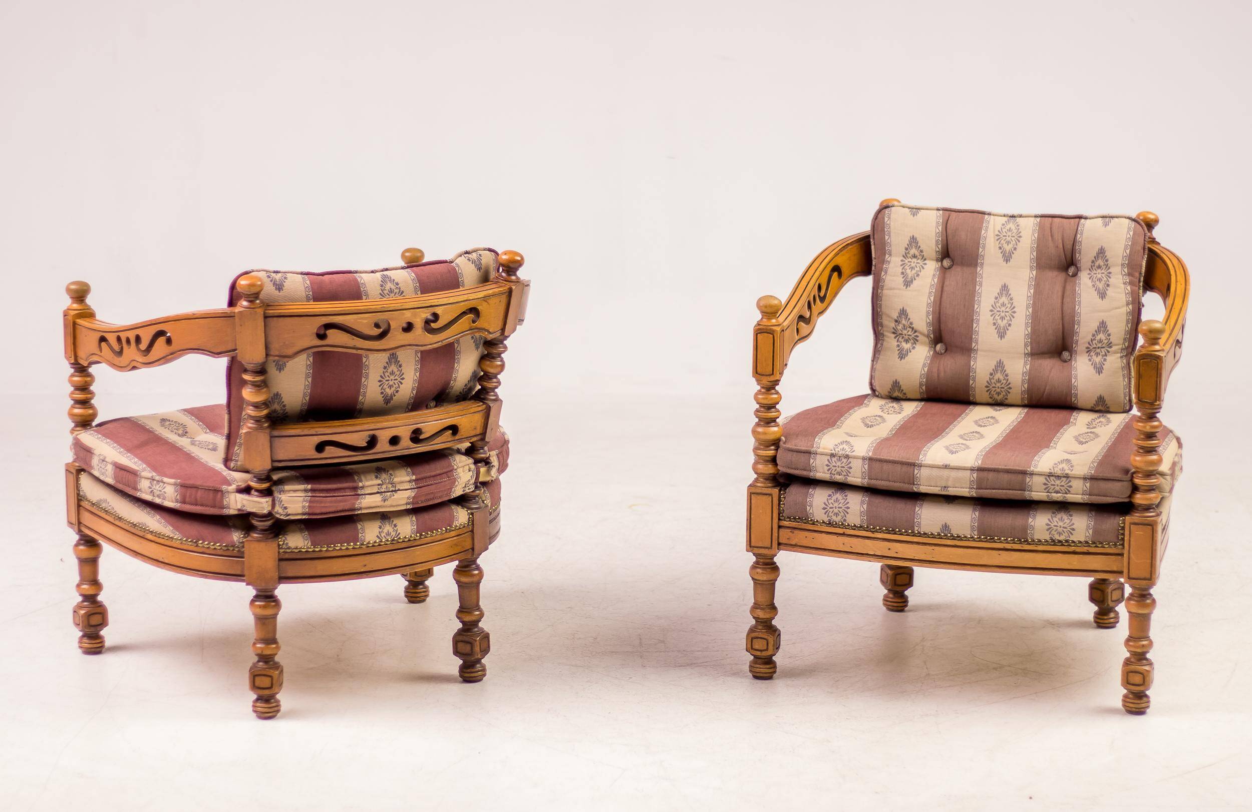 Pair of Giorgetti "1975 Gallery" armchairs in carved wood, original upholstery.