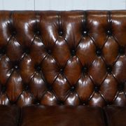 Chesterfield leather canapé in Georgian style with lion paw carved feet.