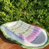 Plate of asparagus with a sauce.