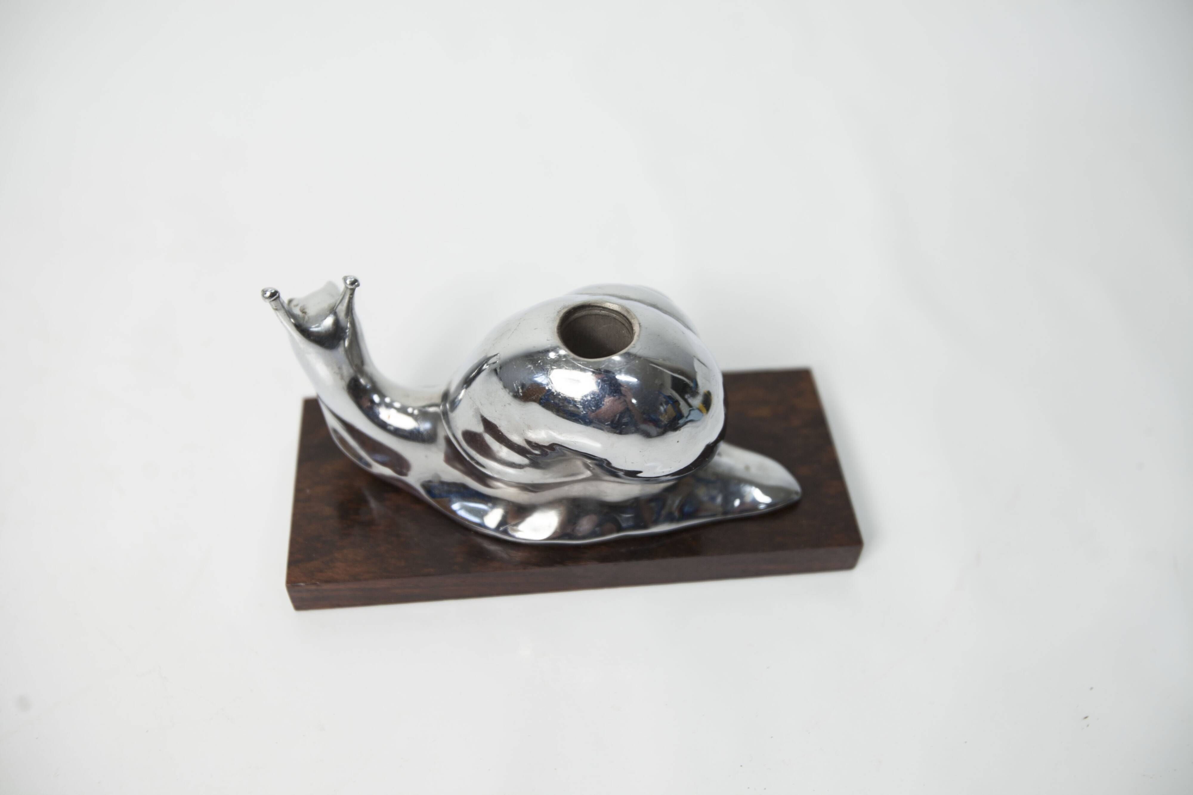 Silver snail candlestick on a teak base 1960