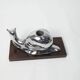 Silver snail candlestick on a teak base 1960