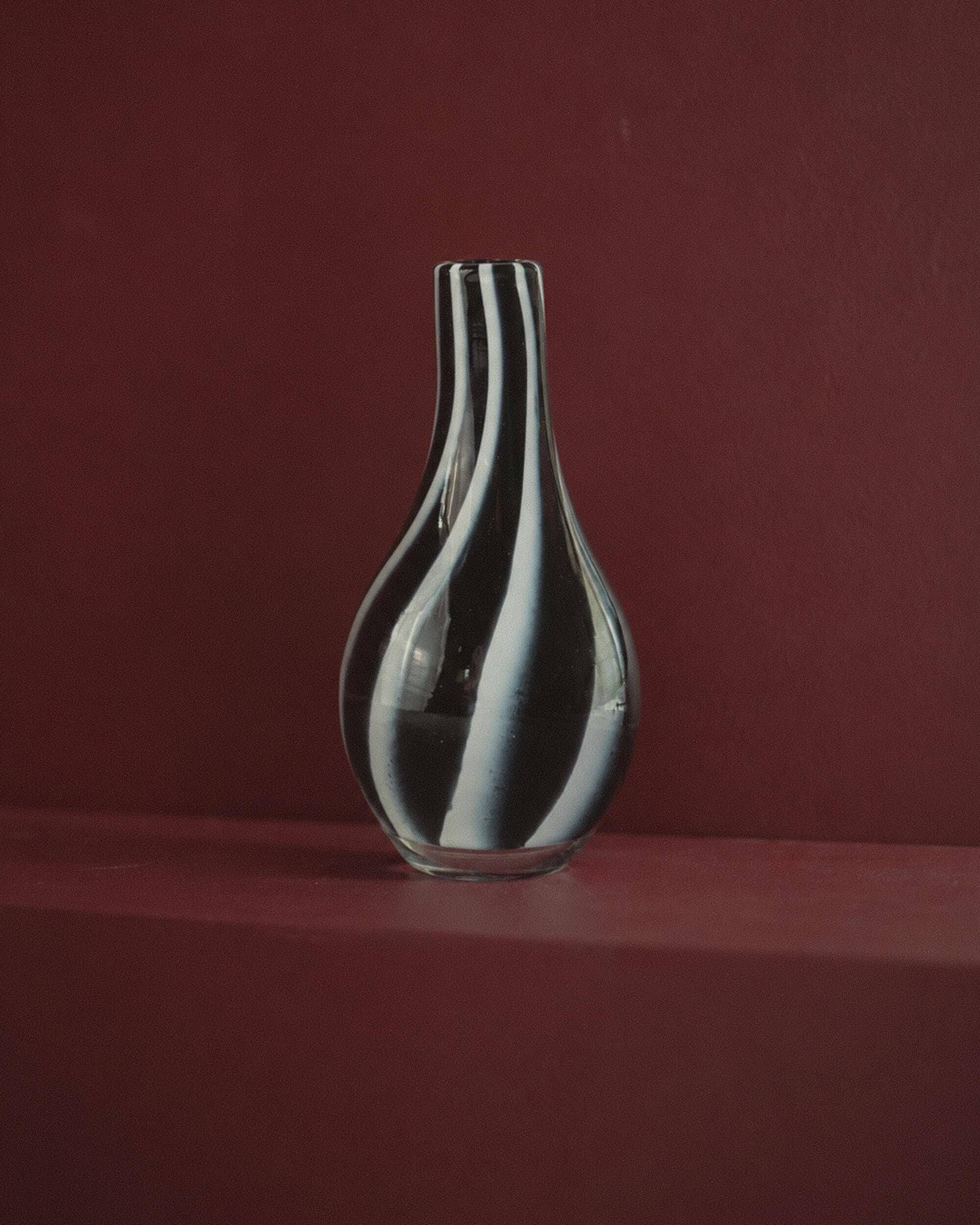 Vintage Murano glass vase from the 1980s, black and white swirl pattern, thick Italian art glass.