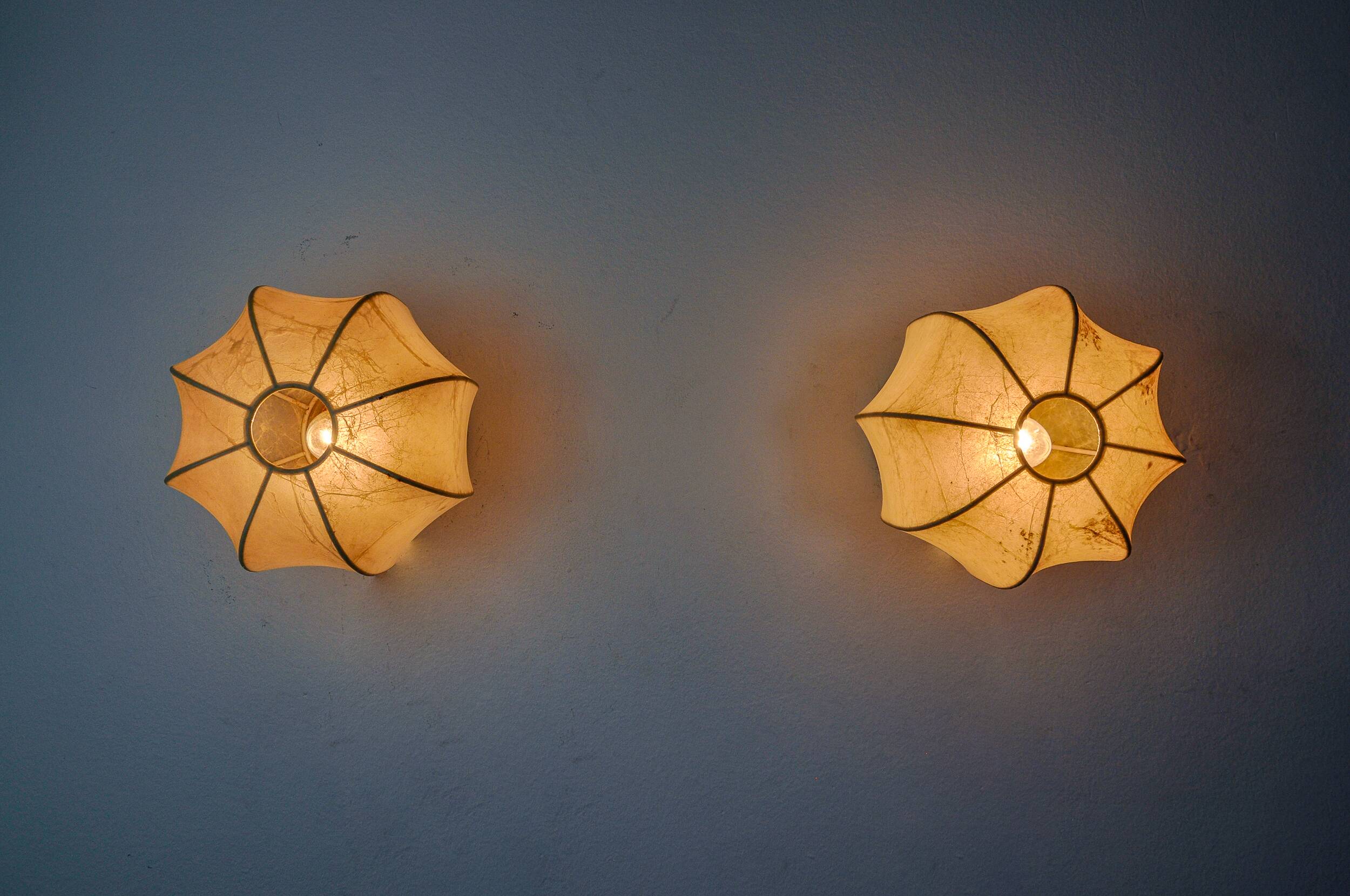 Pair of “cocoon” wall lights, resin and pine, italy, 1970