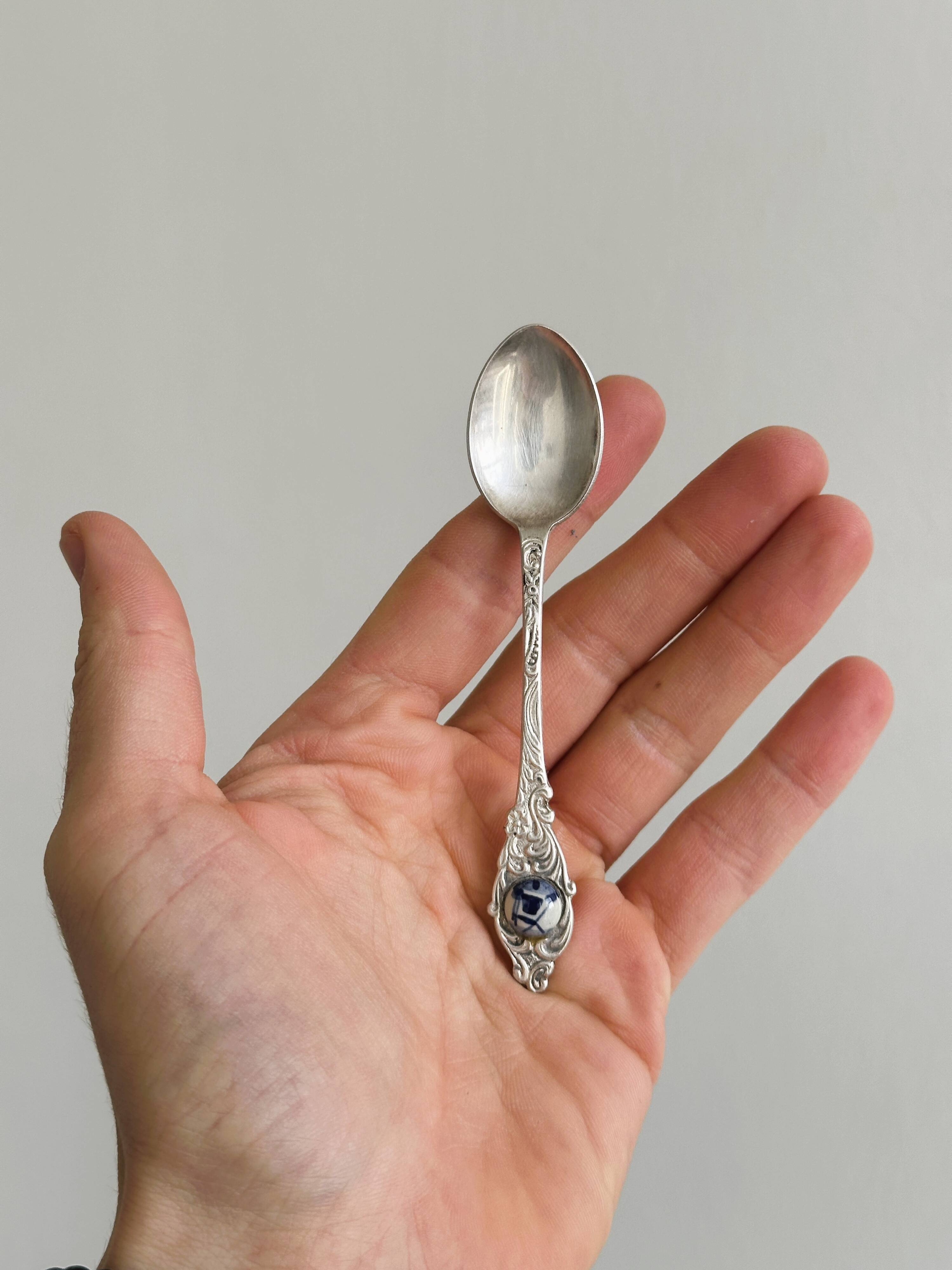Two small metal spoons