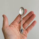 Two small metal spoons