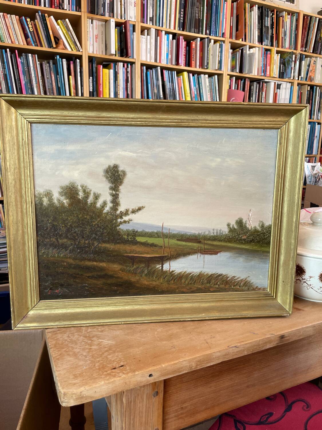 Oil painting of a riverside signed EM