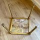 Set of 3 vintage nesting tables in onyx and gold metal from the 1970s.